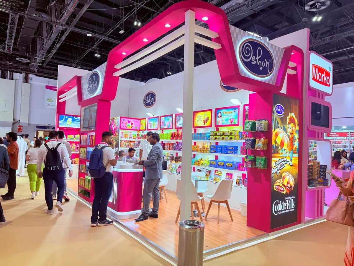 Oshon pink and white stand with curved canopy and product display at ISM Middle East 2025