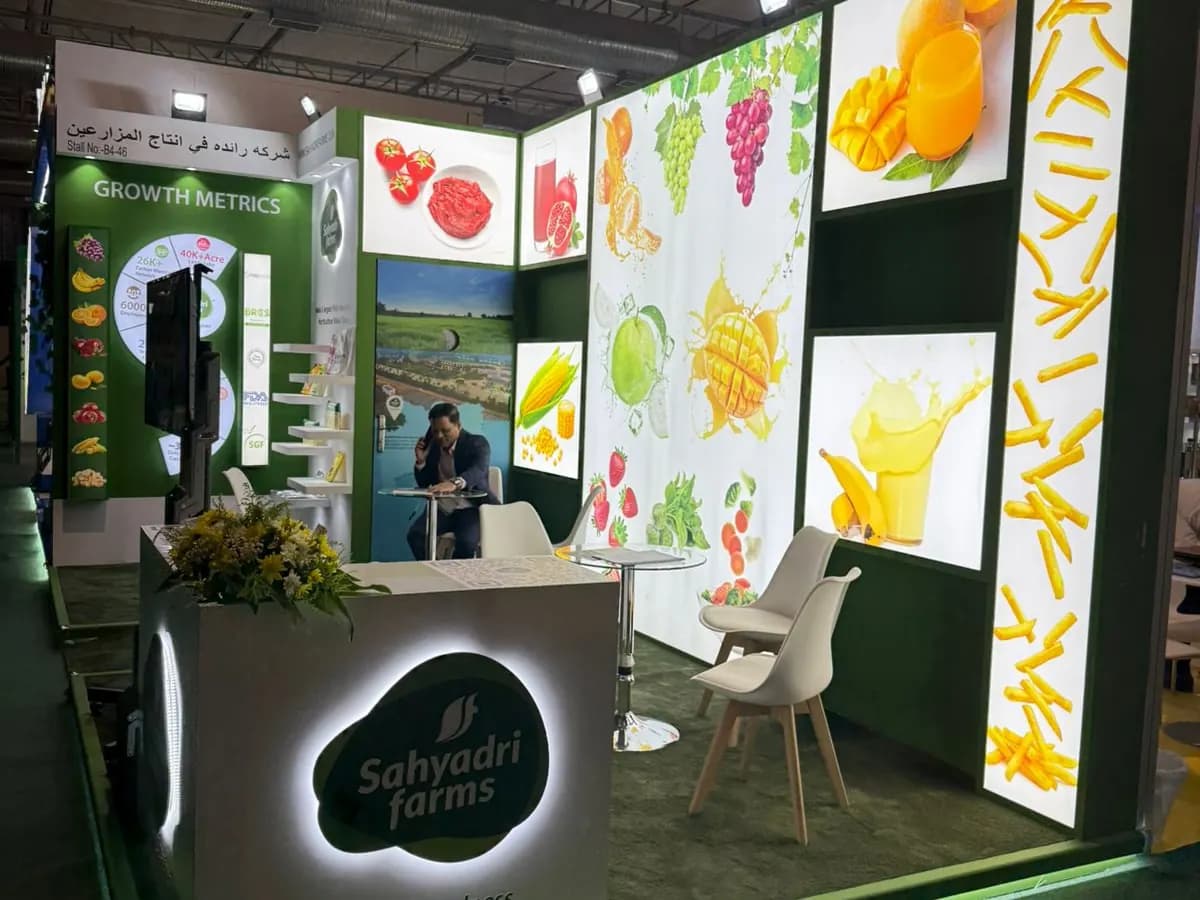 Sahyadri Farms green stand with backlit fruit graphics and counter at The Saudi Food Show 2025