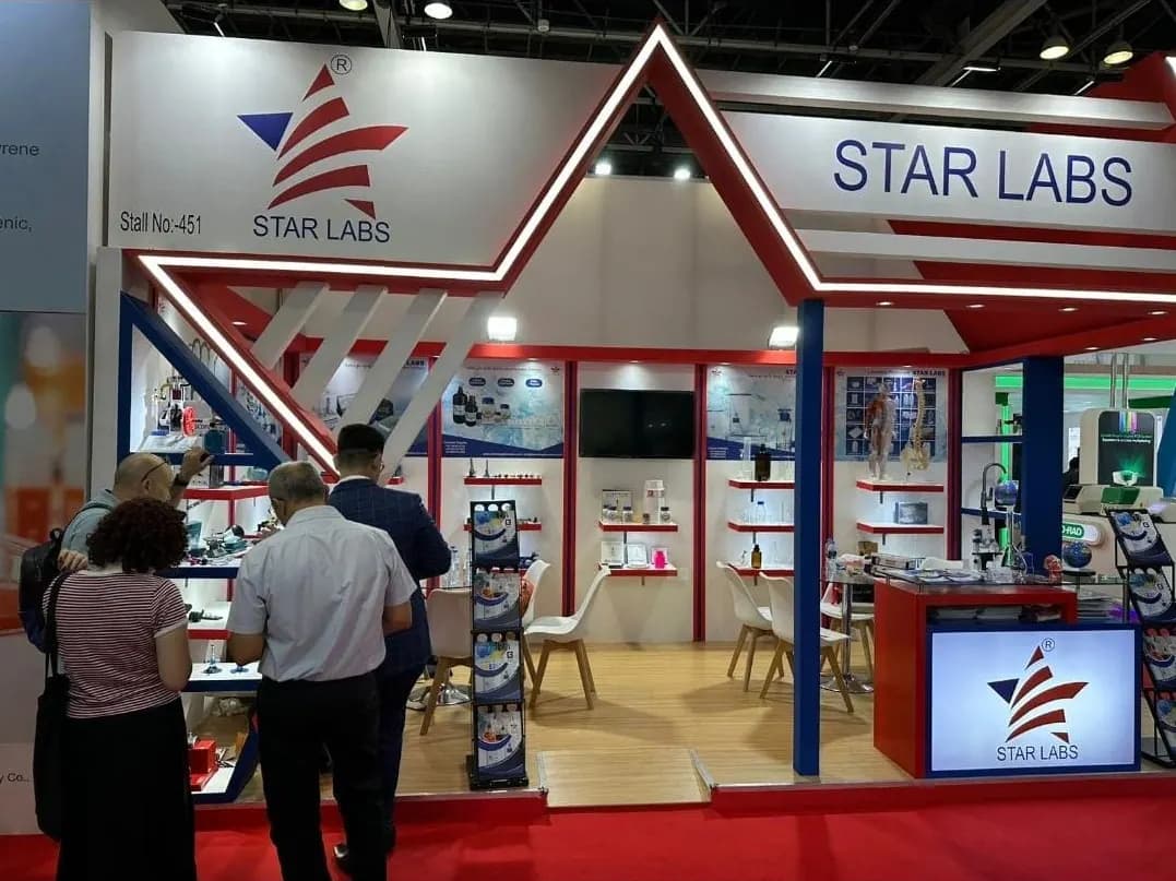 Star Labs corner stand with red gabled fascia and laboratory product shelving at ArabLab 2023, Dubai