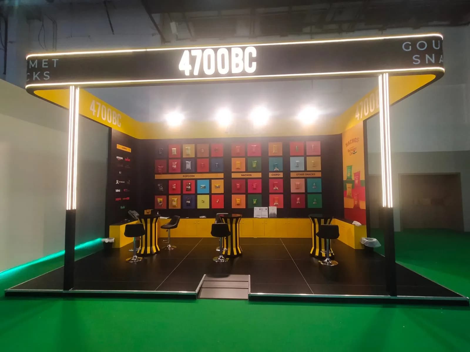 4700BC black and yellow gourmet snacks stand at Gulfood 2026